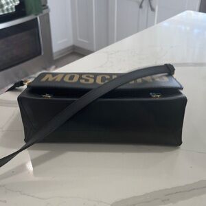 Moschino Black Clutch with Gold Lettering